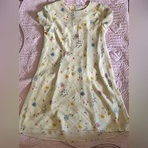 A dress with colorful flowers and U shaped neck lines